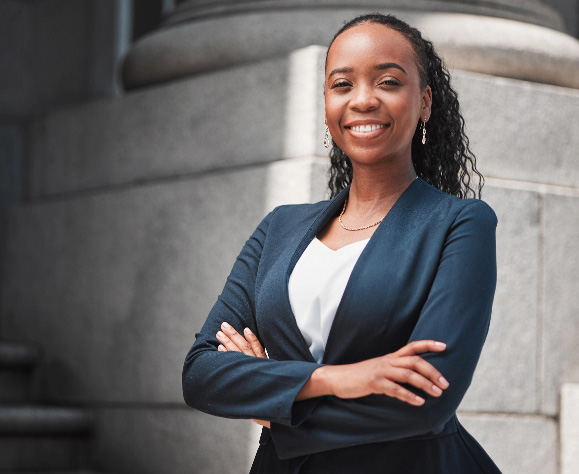 Arms crossed portrait of happy black woman