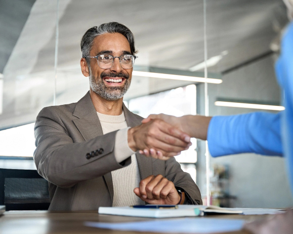 Business professionals shaking hands