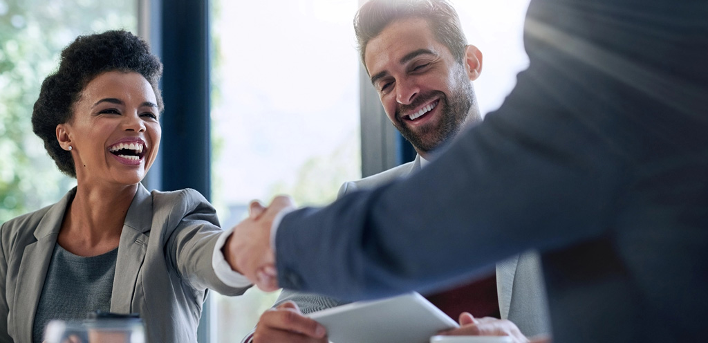 Business team shaking hands success tablet