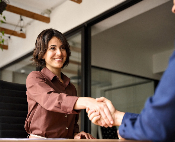 Business woman shaking hands with client