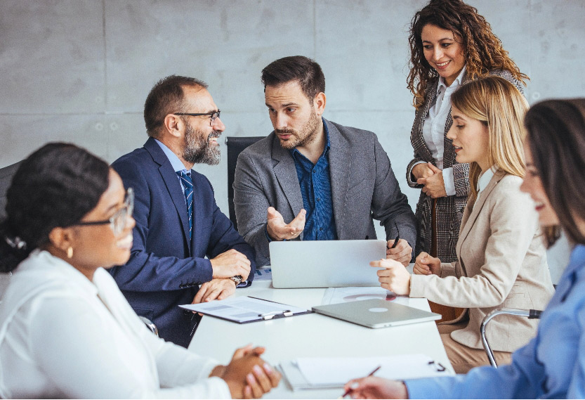 Group of diverse business professionals discuss strategies