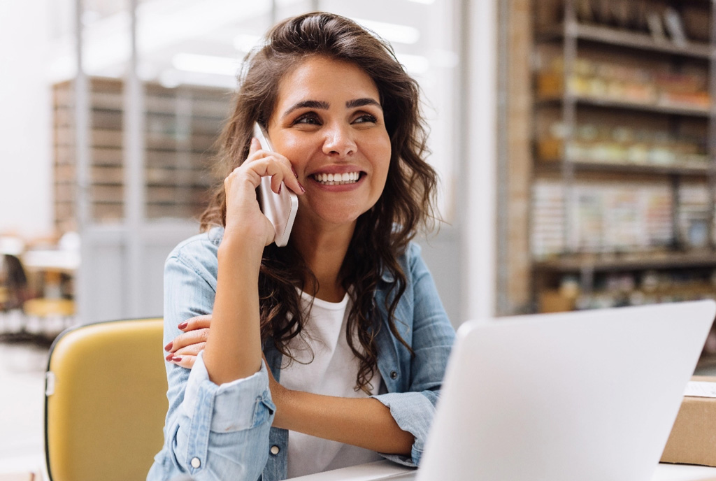 Happy woman using smart phone