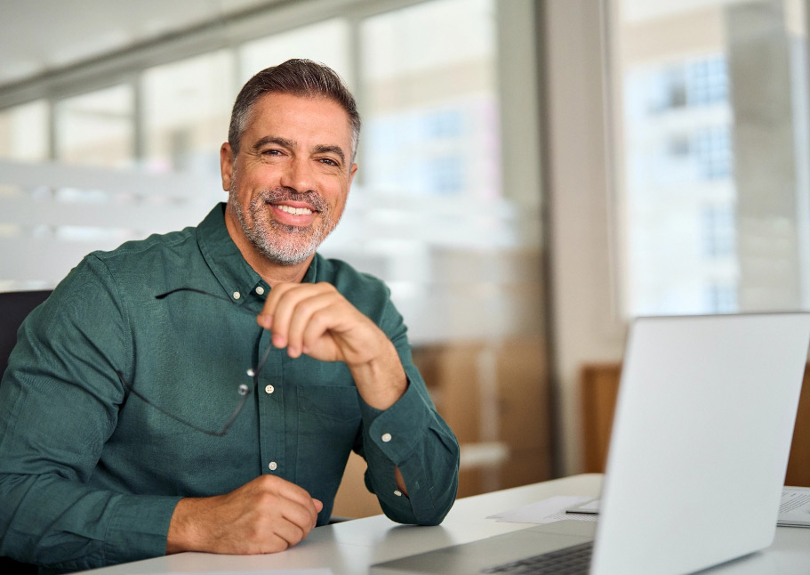 Middle aged professional man at desk left side