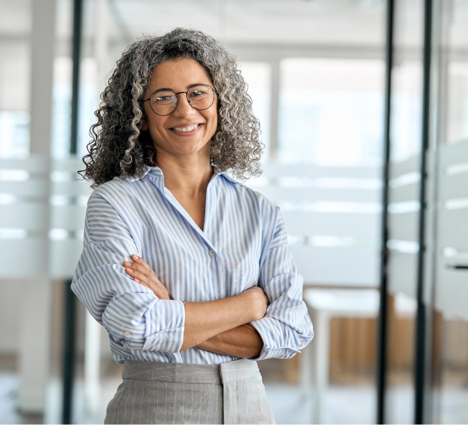Middle aged professional woman with arms folded