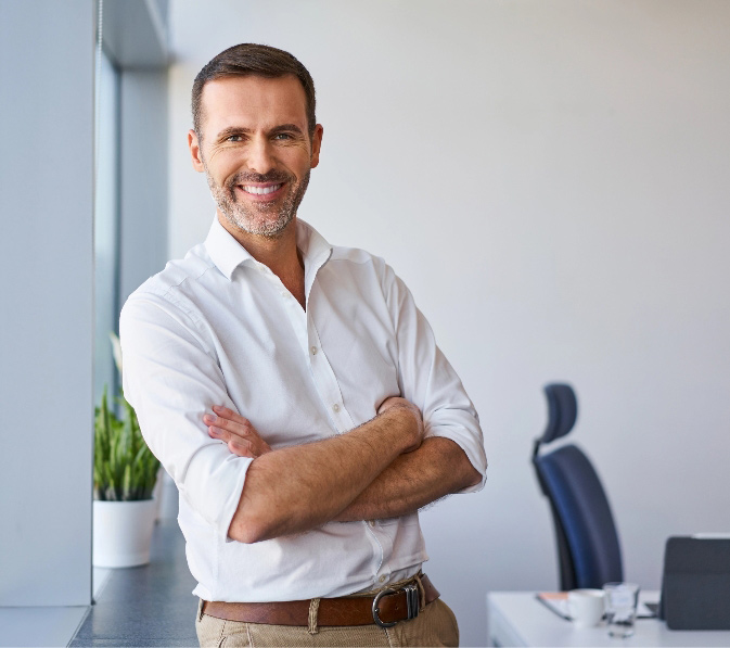 Smart dressed casual business man arms folded