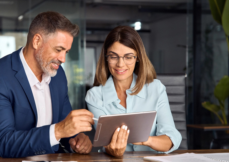 Two professionals looking at tablet