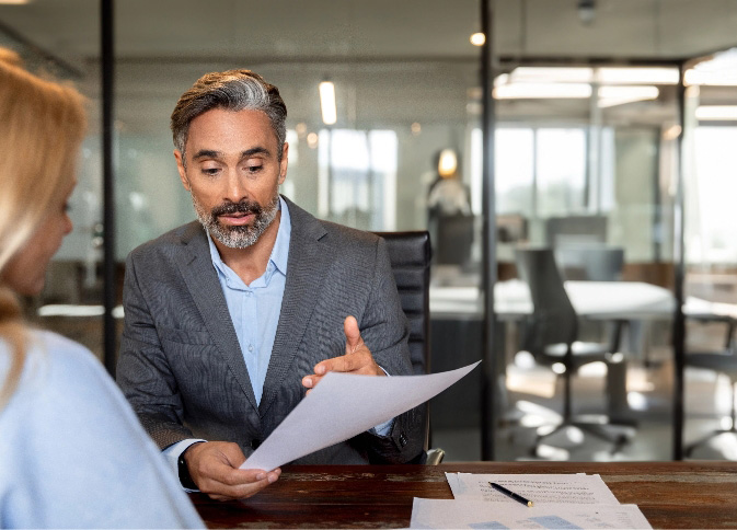 Two professionals review business plans