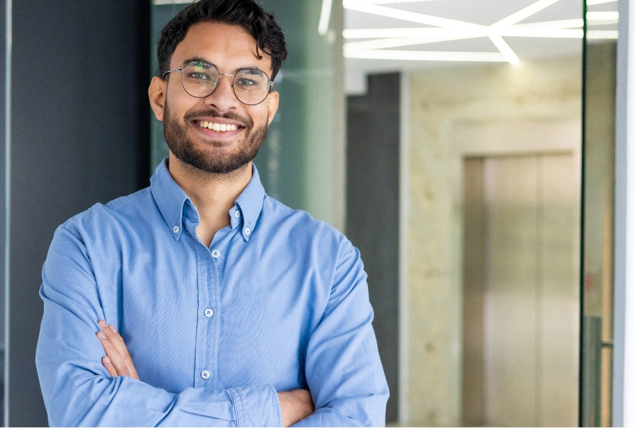 Young casual professional with arms folded